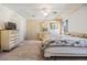 Bright bedroom featuring a large bed and ample closet space at 5330 Dean Dairy Rd, Zephyrhills, FL 33541