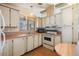 This kitchen offers ample cabinet space and a dining area at 5330 Dean Dairy Rd, Zephyrhills, FL 33541