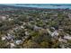 Aerial view showcases the area's homes with tree coverage, giving a secluded feel at 620 Scotland St, Dunedin, FL 34698