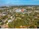 Aerial shot of a property and surrounding area featuring buildings and greenery at 620 Scotland St, Dunedin, FL 34698