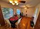 Cozy dining area with hardwood floors, natural light, and traditional furnishings at 620 Scotland St, Dunedin, FL 34698