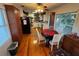 Cozy dining area with hardwood floors, natural light, and traditional furnishings at 620 Scotland St, Dunedin, FL 34698