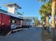 An espresso bar on the street features outdoor seating, palm trees, and a ramp for accessibility at 620 Scotland St, Dunedin, FL 34698