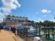 Waterfront restaurant and dock in Dunedin, Florida, with boats and a sunny sky at 620 Scotland St, Dunedin, FL 34698