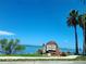 Welcome to Dunedin sign overlooking a scenic waterfront view with palm trees at 620 Scotland St, Dunedin, FL 34698