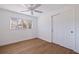 Clean, bright bedroom with white walls, modern ceiling fan and window providing natural light at 6905 122Nd Dr, Largo, FL 33773