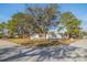 A corner-lot home with mature trees providing ample shade and curb appeal at 6905 122Nd Dr, Largo, FL 33773