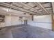 Spacious garage with painted concrete floors, white walls, and overhead lighting provides ample storage and parking at 6905 122Nd Dr, Largo, FL 33773