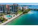 Aerial view of waterfront condo with pool and walkway at 7400 Sun Island S Dr # 207, South Pasadena, FL 33707