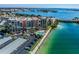 Aerial view of condo building with waterfront access and pool at 7400 Sun Island S Dr # 207, South Pasadena, FL 33707