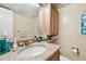 Small bathroom with granite countertop and sink at 7400 Sun Island S Dr # 207, South Pasadena, FL 33707