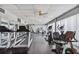 Modern fitness center featuring treadmills and other cardio equipment at 7400 Sun Island S Dr # 207, South Pasadena, FL 33707