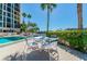 Relaxing patio area with table and chairs near pool at 7400 Sun Island S Dr # 207, South Pasadena, FL 33707