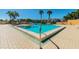 Community pool and spa area with surrounding patio furniture at 7400 Sun Island S Dr # 207, South Pasadena, FL 33707