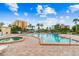 Inviting heated pool and spa with surrounding patio furniture at 7400 Sun Island S Dr # 207, South Pasadena, FL 33707