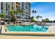 Inviting community pool area with ample lounge chairs at 7400 Sun Island S Dr # 207, South Pasadena, FL 33707