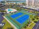 Aerial view of two well-maintained tennis courts at 7400 Sun Island S Dr # 207, South Pasadena, FL 33707