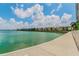 Stunning waterfront view of the community with walkway and lush landscaping at 7400 Sun Island S Dr # 207, South Pasadena, FL 33707