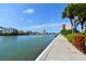 Scenic waterfront walkway with lush landscaping at 7400 Sun Island S Dr # 207, South Pasadena, FL 33707