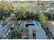 Aerial view of a single Gathering home with solar panels, a pool, and a waterway at 746 31St Ne Ave, St Petersburg, FL 33704