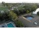 Aerial view of home featuring a pool, backing onto a serene waterway and lush green golf course at 746 31St Ne Ave, St Petersburg, FL 33704