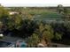 Beautiful backyard aerial view of a home overlooking a waterway, with lush green golf course in the distance at 746 31St Ne Ave, St Petersburg, FL 33704