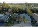 Aerial view of a single Gathering home with solar panels, a pool, and a waterway at 746 31St Ne Ave, St Petersburg, FL 33704