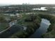 Beautiful aerial view of golf course community near a lake and surrounding residential homes and a skyline at 746 31St Ne Ave, St Petersburg, FL 33704