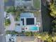 Aerial view of single Gathering home featuring a pool, waterway, and solar panels at 746 31St Ne Ave, St Petersburg, FL 33704