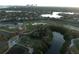 Beautiful aerial view of golf course community near a lake and surrounding residential homes and a skyline at 746 31St Ne Ave, St Petersburg, FL 33704