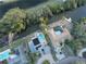 Aerial view of two single Gathering homes on a waterway, one with a pool and one with a dock at 746 31St Ne Ave, St Petersburg, FL 33704