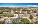 Aerial view of a home in a suburban neighborhood with mature trees and nearby amenities at 7800 Willow Brook Ct, Hudson, FL 34667