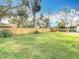 Wide shot of a large backyard with a new wood fence ensuring privacy and security at 7800 Willow Brook Ct, Hudson, FL 34667