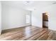 Minimalist bedroom with wood floors and an ensuite bathroom with modern finishes at 7800 Willow Brook Ct, Hudson, FL 34667