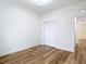 Bright bedroom with closet and hardwood floors leading to another room at 7800 Willow Brook Ct, Hudson, FL 34667