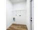 Functional laundry room with hookups and shelving at 7800 Willow Brook Ct, Hudson, FL 34667