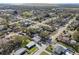 Neighborhood aerial view showcasing the home's location in a residential area with mature trees and nearby amenities at 8303 Croton Ave, Tampa, FL 33619