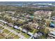 This aerial view shows the property's location and surrounding green spaces and neighborhood at 8303 Croton Ave, Tampa, FL 33619