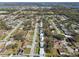 This aerial view shows the houses and the surrounding streets in this community at 8303 Croton Ave, Tampa, FL 33619