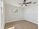 Bedroom with LVP flooring and natural light at 8303 Croton Ave, Tampa, FL 33619