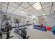 Well-equipped gym featuring exercise machines, weights, and natural light at 860 Virginia St # 303, Dunedin, FL 34698