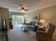 Bright and airy living room with comfortable seating and access to a balcony at 860 Virginia St # 303, Dunedin, FL 34698