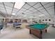 Large recreation room with a pool table and plenty of space for socializing at 860 Virginia St # 303, Dunedin, FL 34698