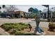 A beautiful sculpture of a blue dolphin with a retail business in the background at 860 Virginia St # 303, Dunedin, FL 34698