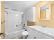 Bright bathroom featuring a tub with shower, a tiled wall, and a vanity at 8730 143Rd N St, Seminole, FL 33776