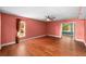 Empty bedroom with wood floors and view to an outdoor garden at 8730 143Rd N St, Seminole, FL 33776