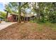 Exterior view of a brick home with mature trees in the yard at 8730 143Rd N St, Seminole, FL 33776