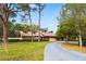 Attractive home boasting well-manicured landscaping, a circular driveway, and dormer windows for added curb appeal at 8730 143Rd N St, Seminole, FL 33776