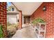 Tiled front porch with an ornate wood door at 8730 143Rd N St, Seminole, FL 33776