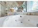 Luxurious jetted bathtub with a view at 905 Linn Harbor Ct, Tarpon Springs, FL 34689